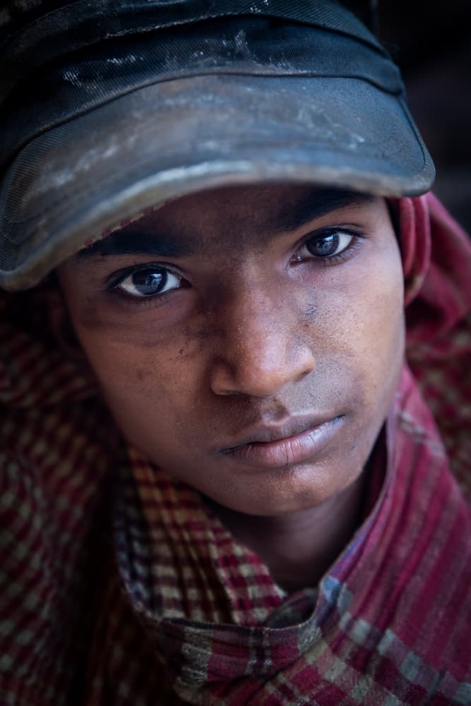 Young Boy's Intense Gaze by Richard Huang — canvas wall art