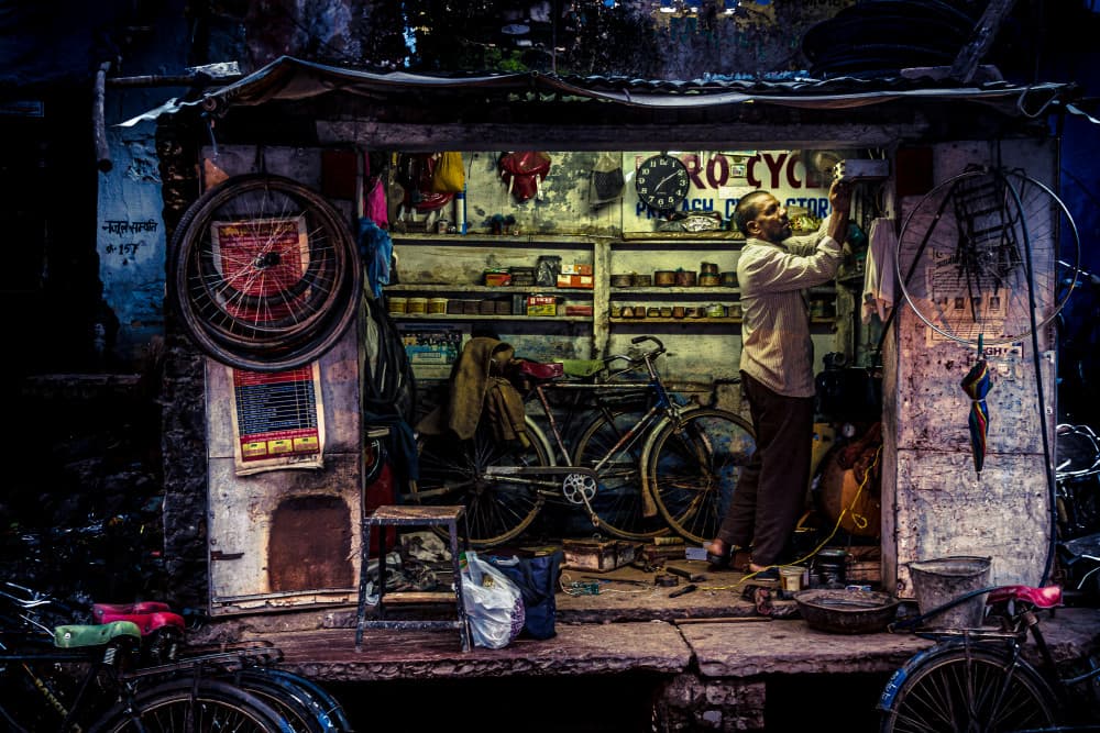 Night Bicycle Repair Shop by Marco Tagliarino — canvas wall art