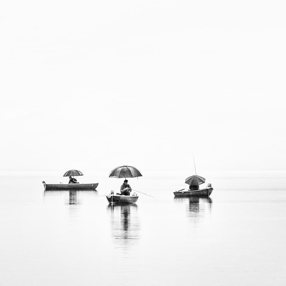 Three Umbrella Fishermen by Nina Pauli — canvas wall art