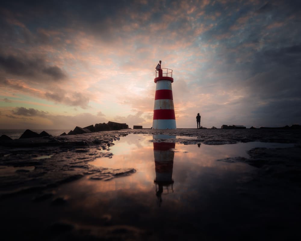 Lighthouse Sunset Reflection by Marco Faria — canvas wall art