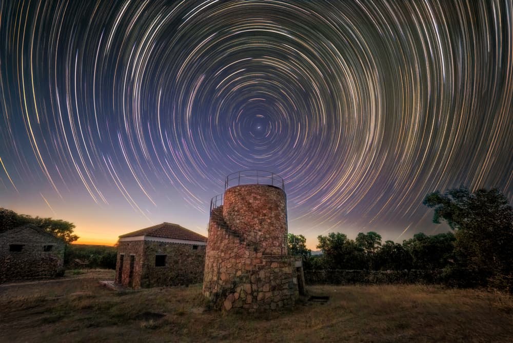 Star Trails Stone Tower by Juan Luis Seco — canvas wall art
