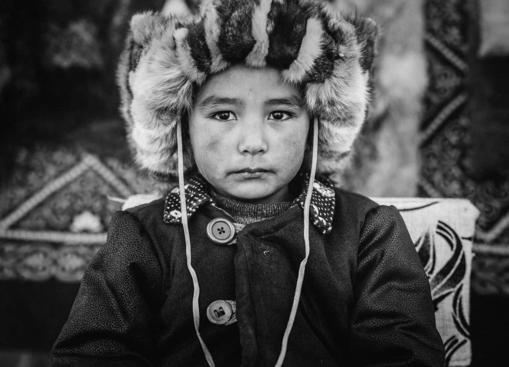 Boy In Fur Hat by ADIREK M — canvas wall art