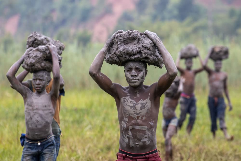 Young Boys Carry Mud by Ella Waldman — canvas wall art