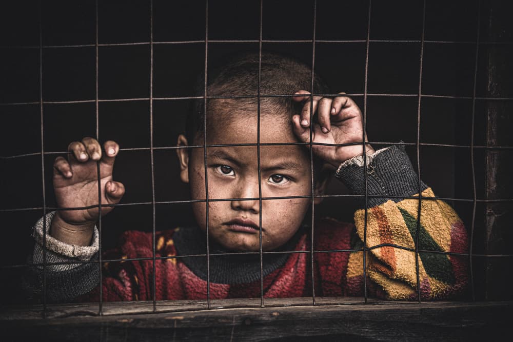 Child Behind Bars by Marco Tagliarino — canvas wall art