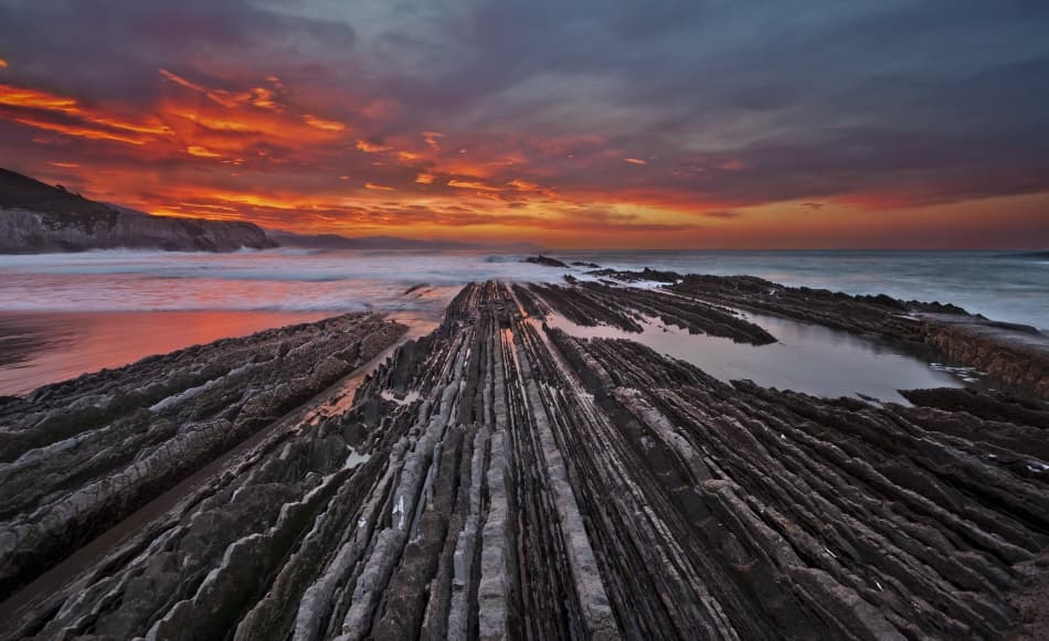 Fiery Sunset Rock Formations by Mikel Lastra — canvas wall art