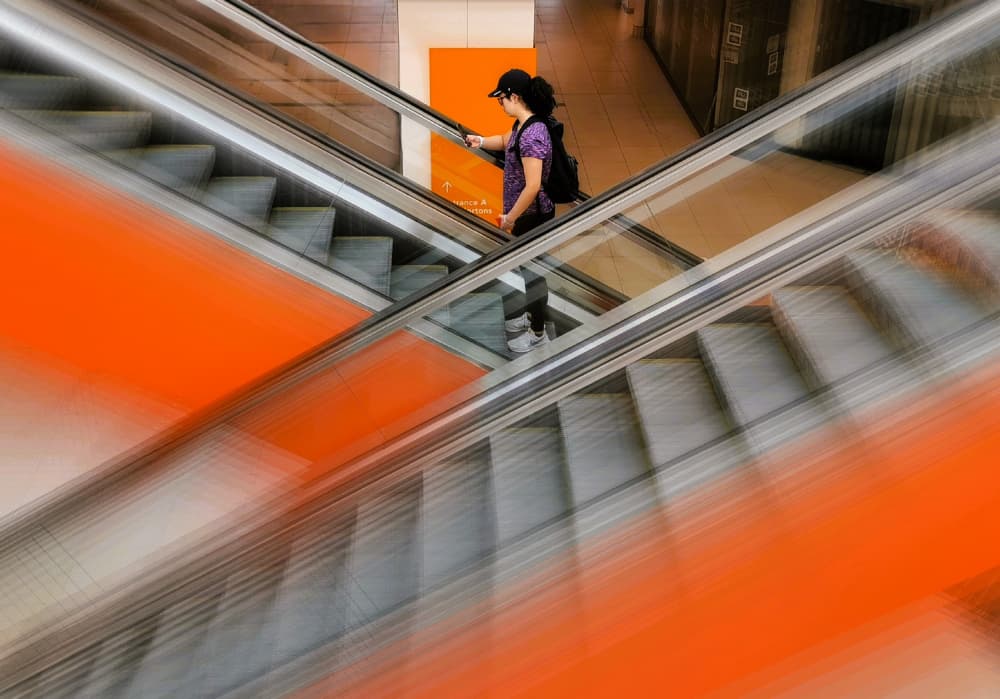 Dynamic Orange Escalator by Jasmine Zhang — canvas wall art