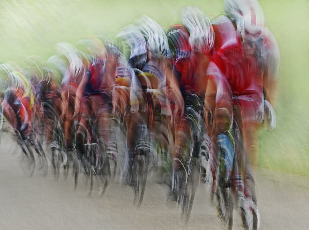 Racing Cyclists Blur by Lou Urlings — canvas wall art