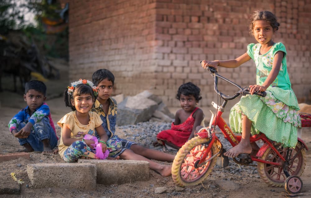 Smiling Kids On Bike by Ludwig Riml — canvas wall art