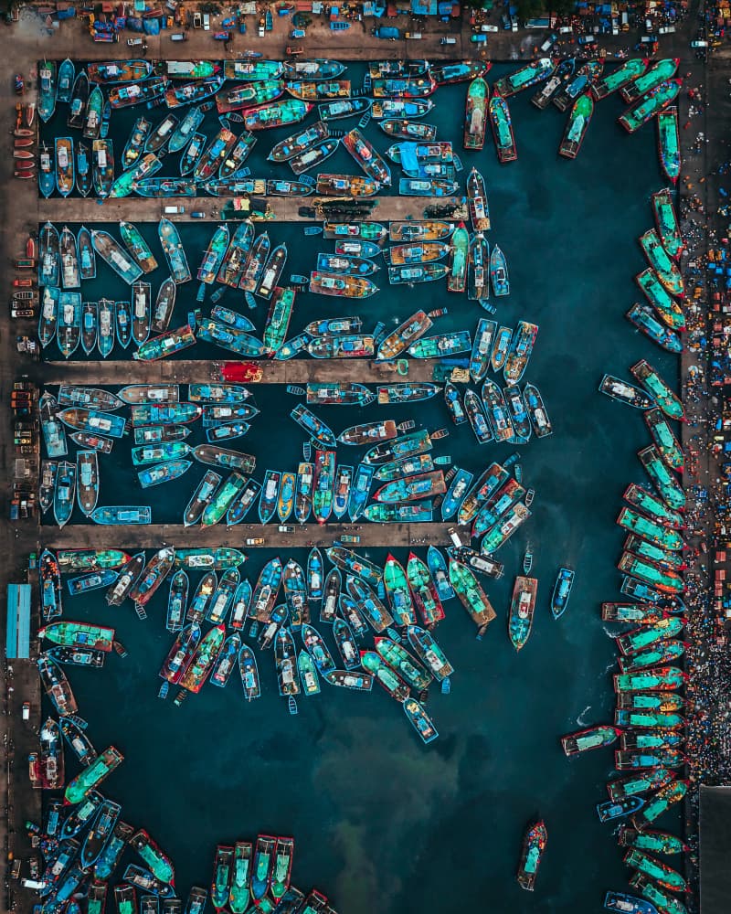 Colorful Harbor Boats by Mahendra Bakle — canvas wall art