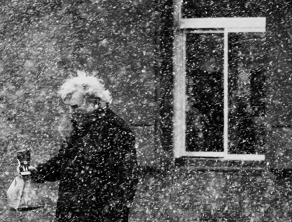 Man in Heavy Snow by Jian Wang — canvas wall art