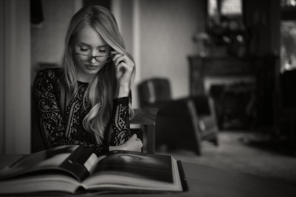 Thoughtful Woman Reading by Chris Bos — canvas wall art