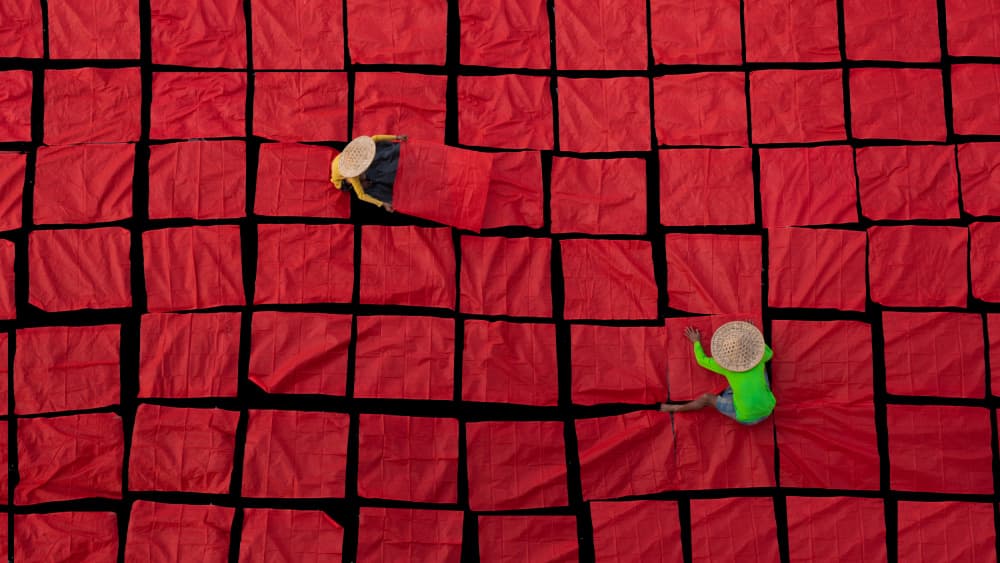 Arranging Red Fabric Squares by Nilendu Banerjee — canvas wall art