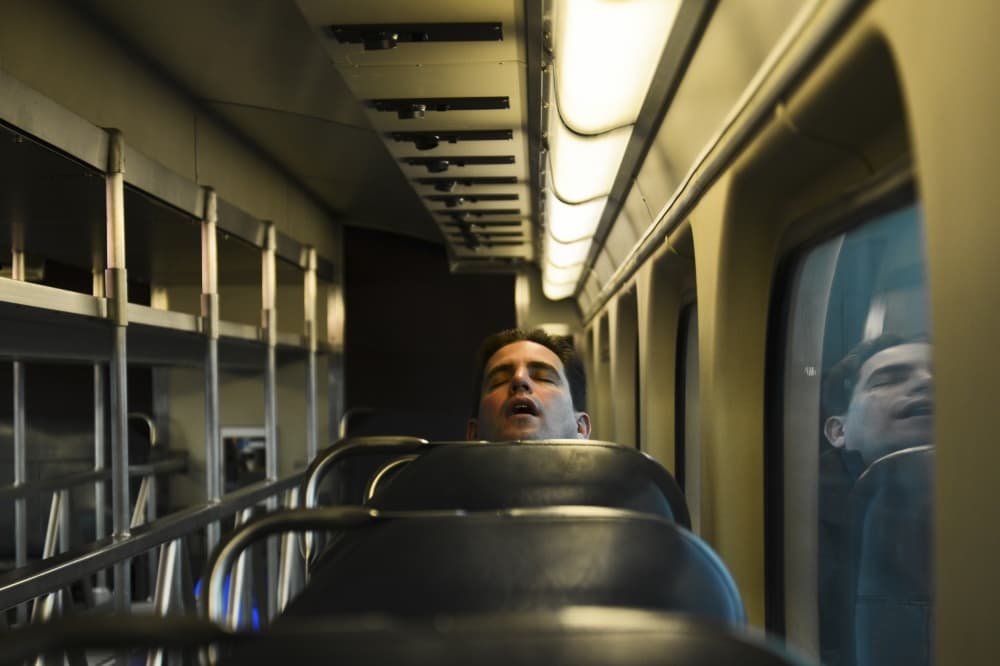 Sleeping Man on Train by Robert Semnic — canvas wall art