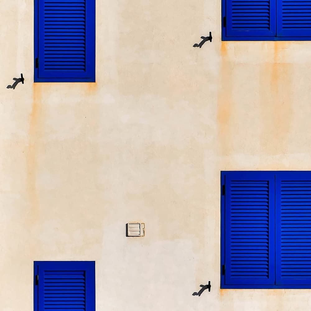 Vibrant Blue Shutters by Markus Auerbach — canvas wall art