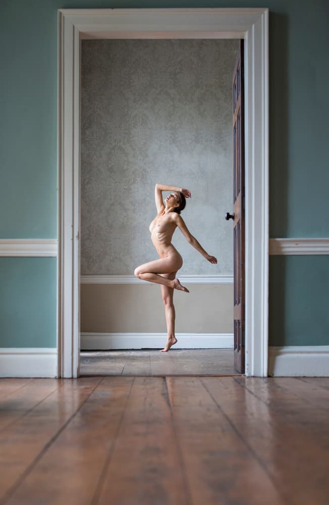 Graceful Doorway Pose by Catchlight Studio — canvas wall art