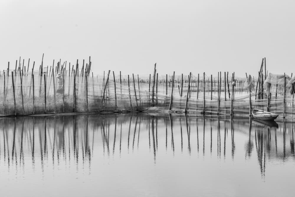 Poles and Boat Reflections by Dzintra Zvagina — canvas wall art