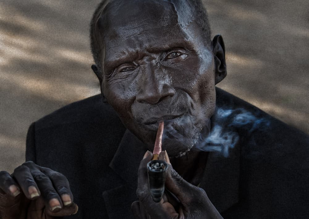 Wise Elder Smoking Pipe by Joxe Inazio Kuesta Garmendia — canvas wall art