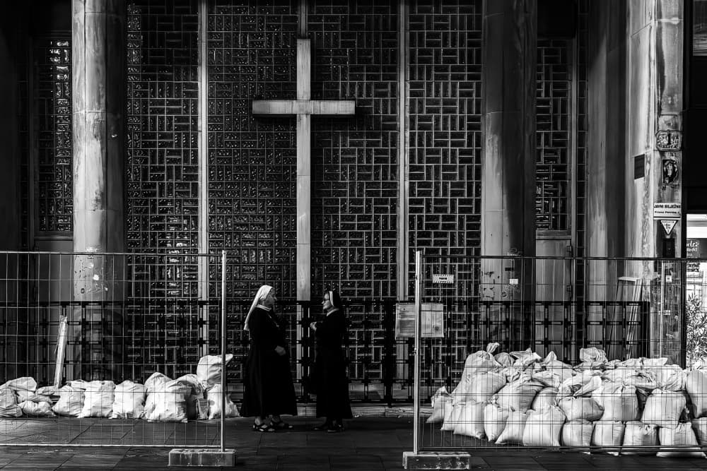 Sisters and Sandbags by Bojan Dzodan — canvas wall art