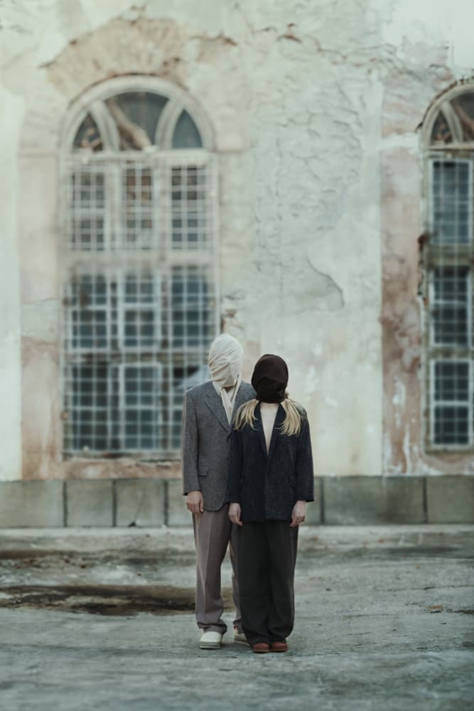 Faceless Figures Old Building by Raluca Arhire — canvas wall art