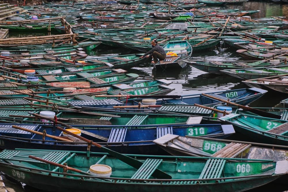 Serene Green Rowboats by Avital Hershkovitz — canvas wall art