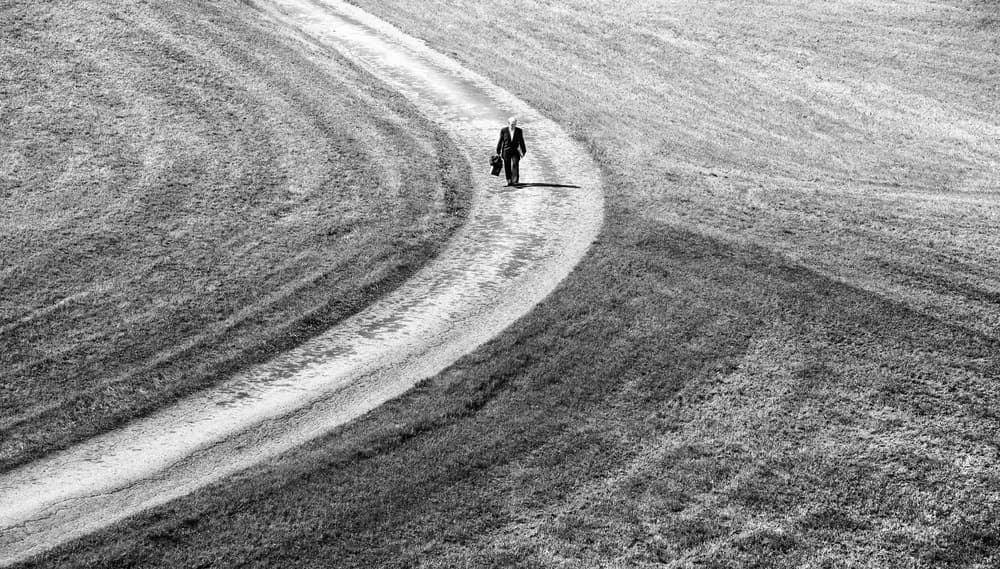 Lone Man on Winding Path by Lorenza Cancian — canvas wall art