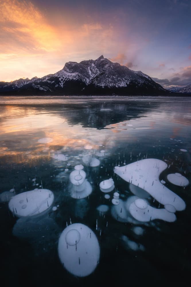 Frozen Lake Mountain Sunset by Yongnan Li (李永男) — canvas wall art