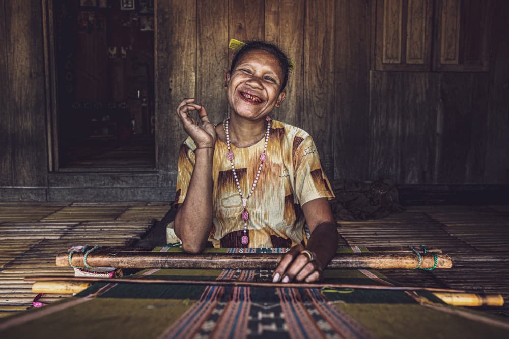 Happy Woman Weaving by Marco Tagliarino — canvas wall art