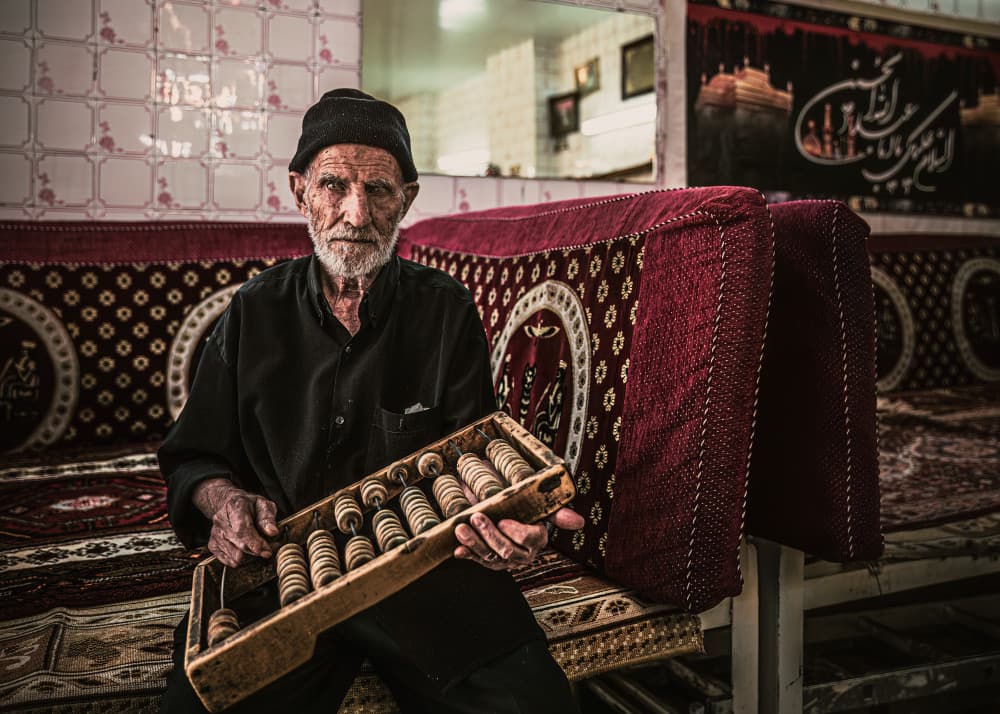 Wise Man Holding Abacus by Marco Tagliarino — canvas wall art