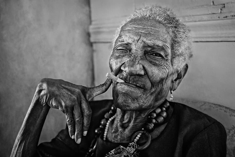 Winking Elderly Woman by PAUL GOMEZ — canvas wall art