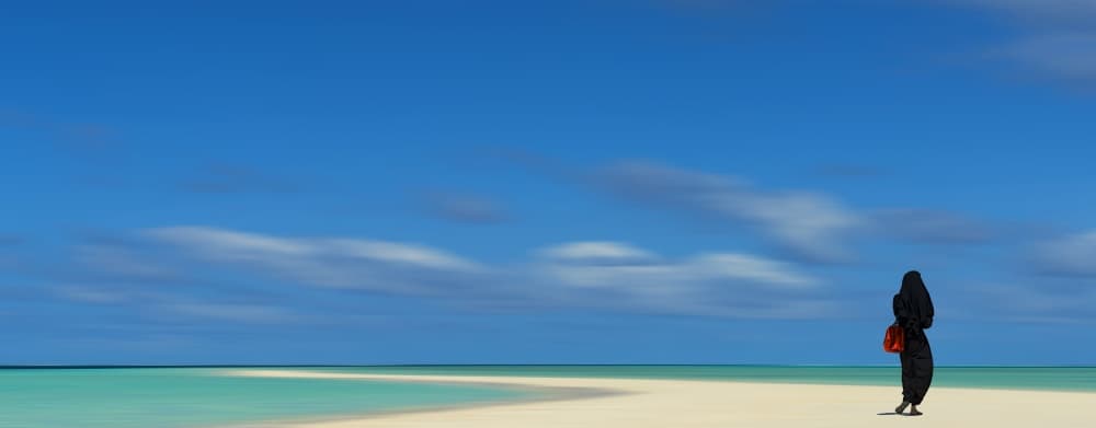 Woman on Serene Beach by Harry Bünger — canvas wall art