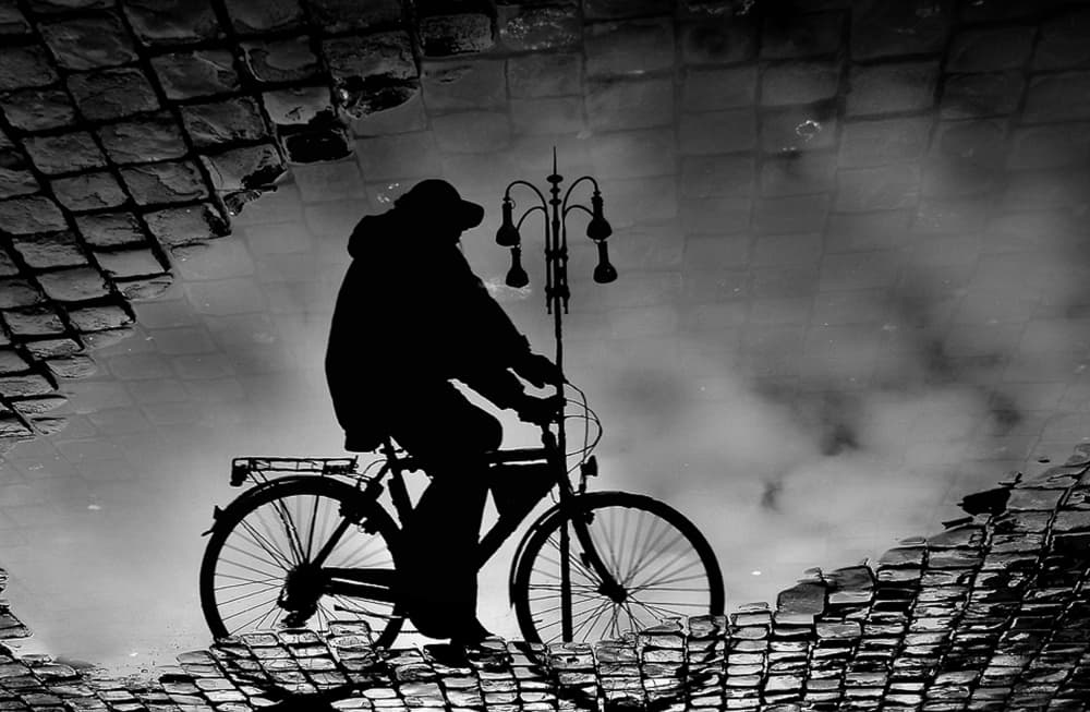Lone Cyclist Reflection by Antonio Grambone — canvas wall art