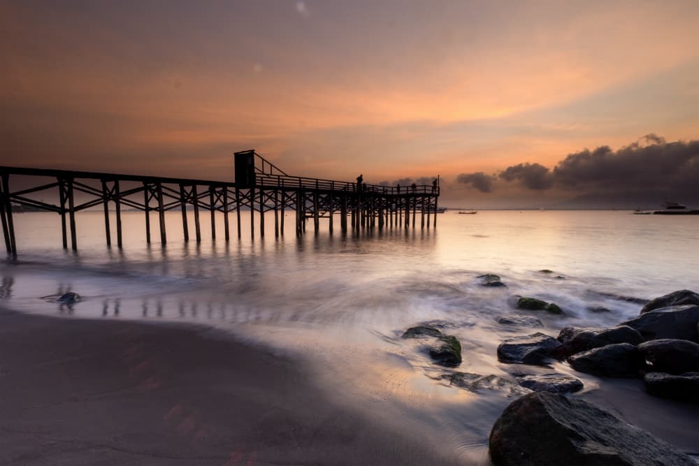 Peaceful Pier at Sunset by Sally Widjaja — canvas wall art