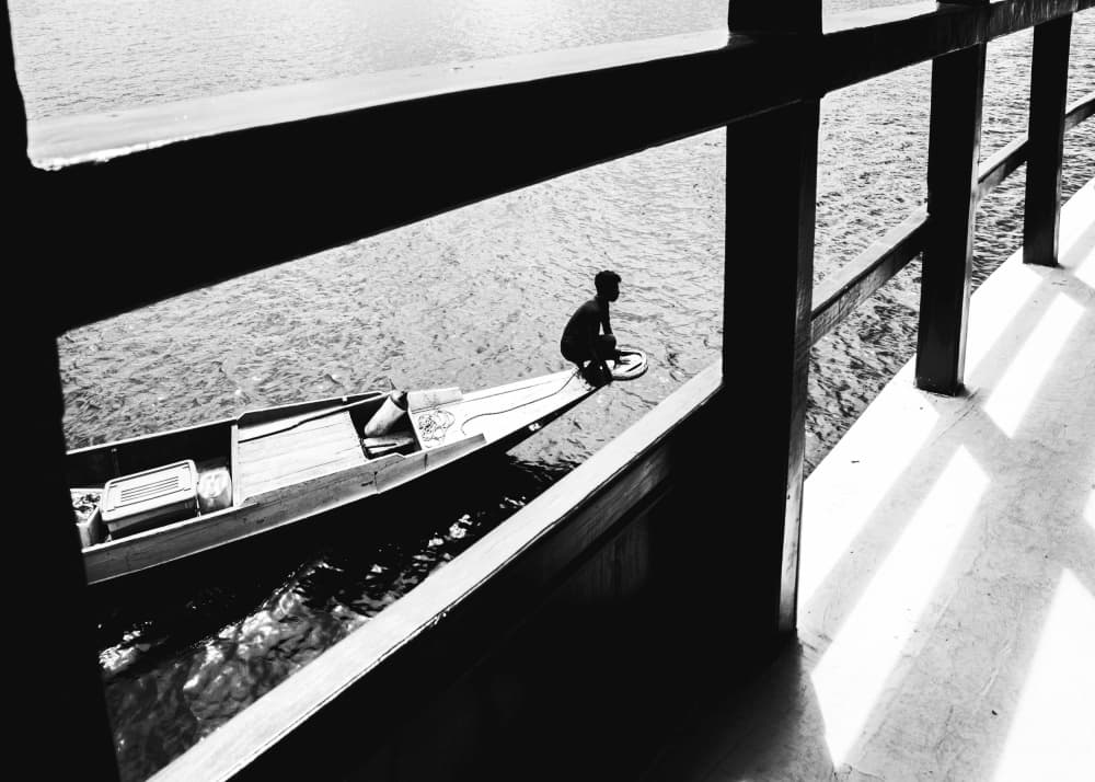 Solitary River Boatman by Alin Federiga — canvas wall art
