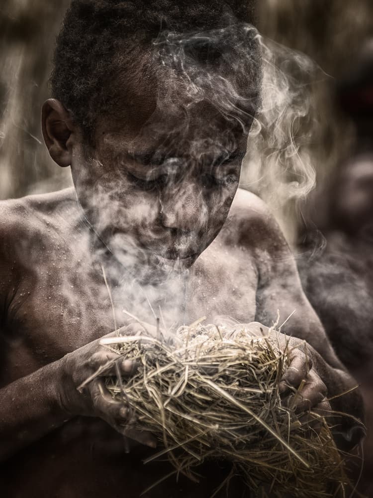 Child Kindling Fire by Pavol Stranak — canvas wall art
