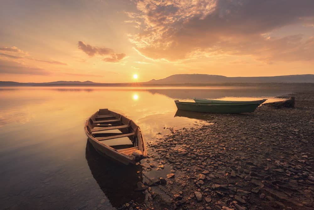 Golden Hour Lake Boats by Dmitry Kupratsevich — canvas wall art