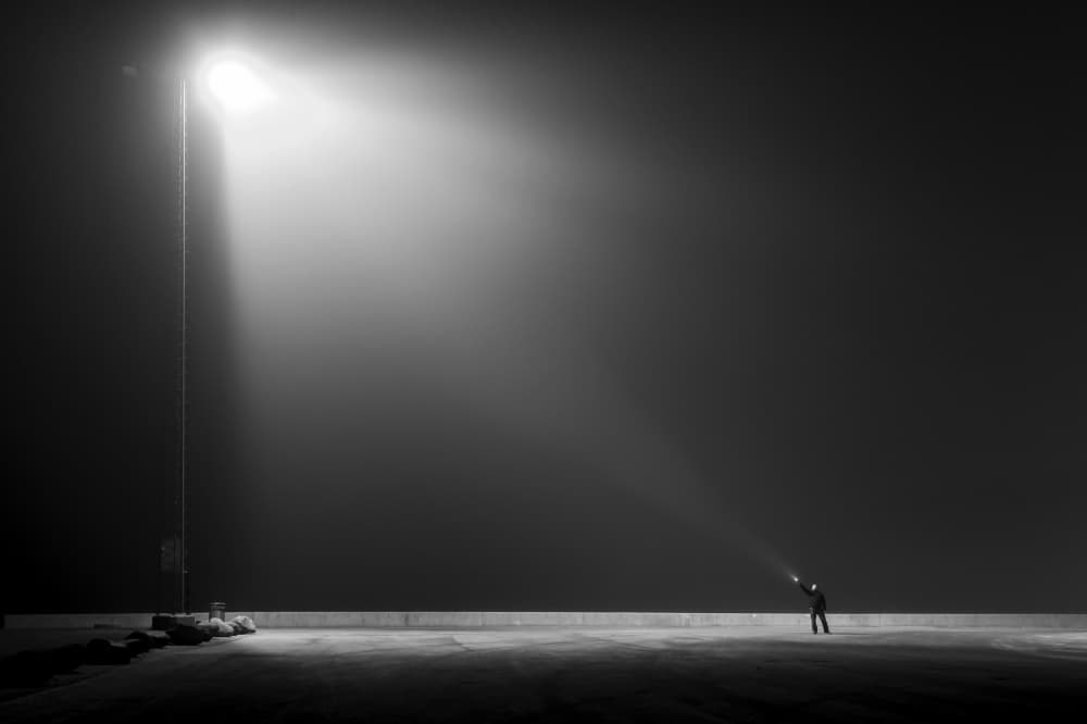 Lone Figure Under Light by Leif Løndal — canvas wall art
