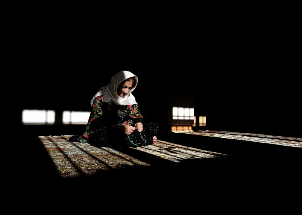 Praying Woman in Sunlight by Shamal Shakibayi — canvas wall art