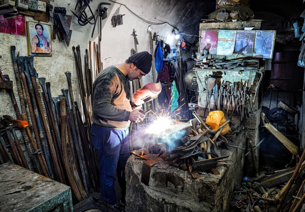 Skilled Welder Sparks by Bashar Alsofey — canvas wall art