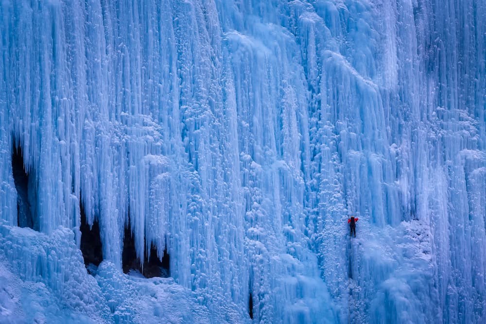 Ice Climber On Frozen Falls by Michael Zheng — canvas wall art