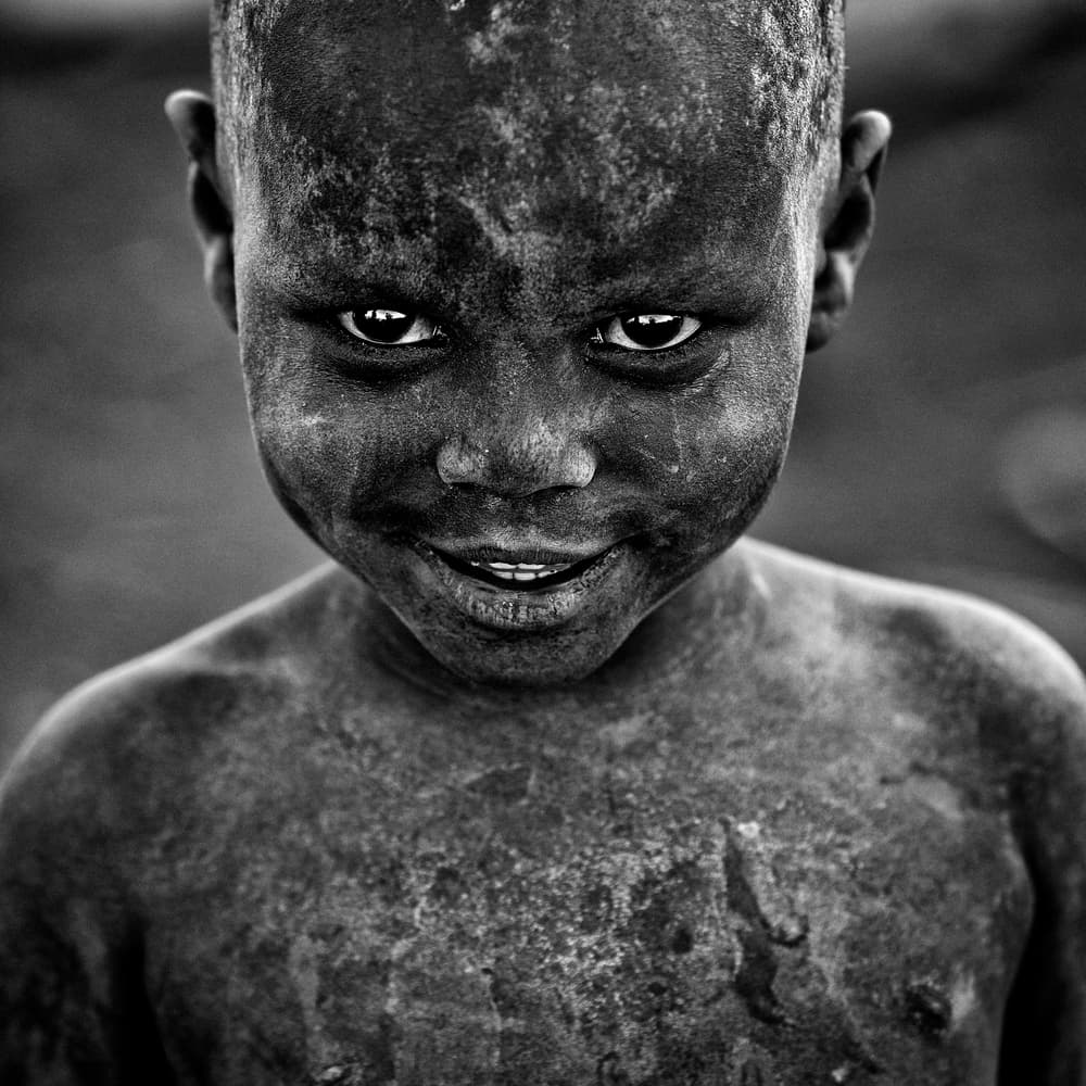 Gritty Child's Smile by Vedran Vidak — canvas wall art