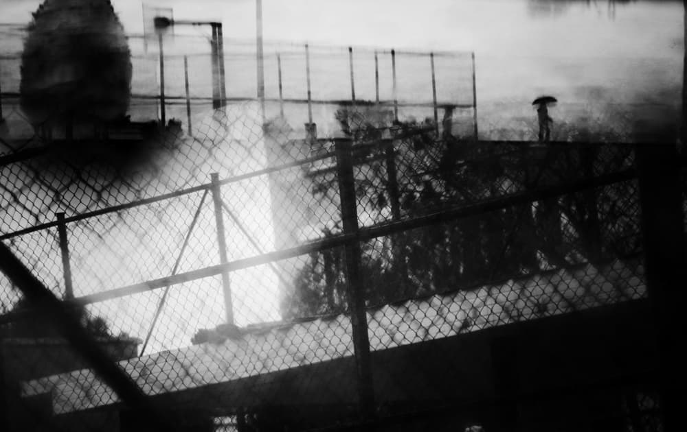 Fenced Rainy Reflections by Ali Ayer — canvas wall art