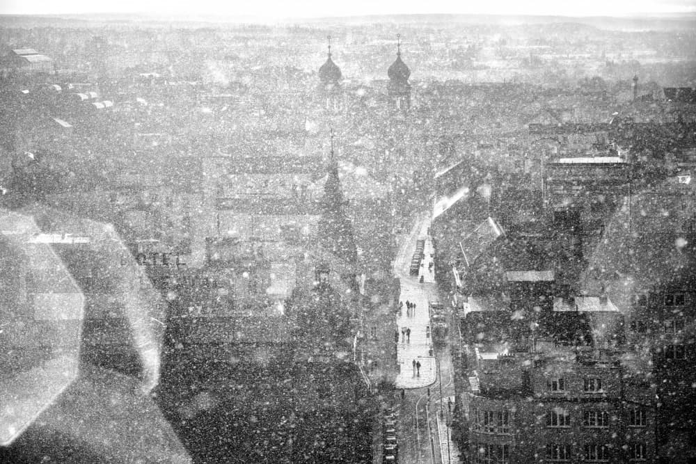 Snowfall Over City by Martin Froyda — canvas wall art