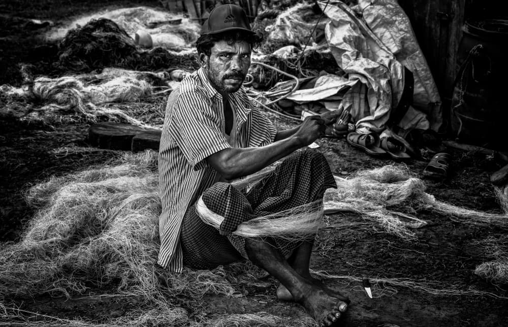 Fisherman Mending Nets by Joxe Inazio Kuesta Garmendia — canvas wall art