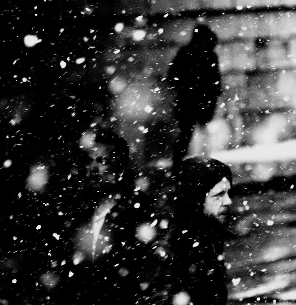 People In Snowy City by Jian Wang — canvas wall art