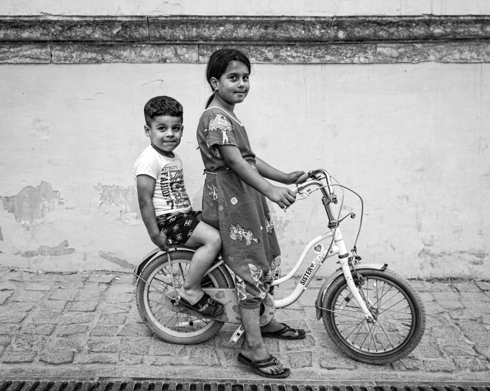Happy Children Bicycle by Bashar Alsofey — canvas wall art
