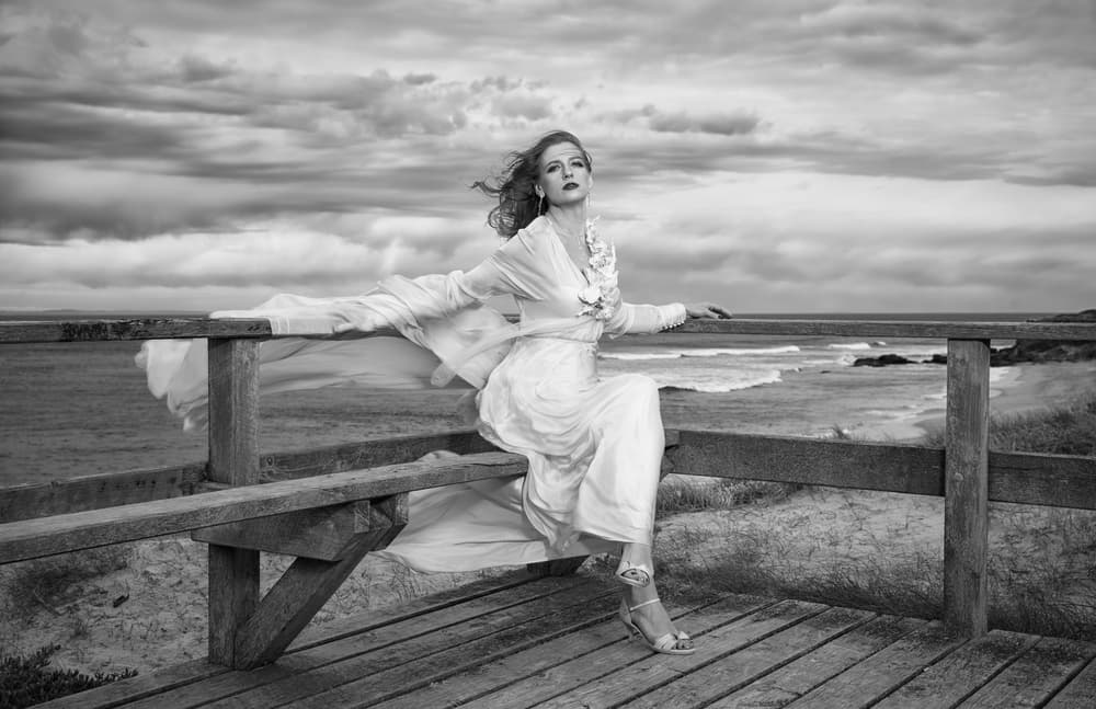 Elegant Woman Stormy Coast by Peter Elgar — canvas wall art