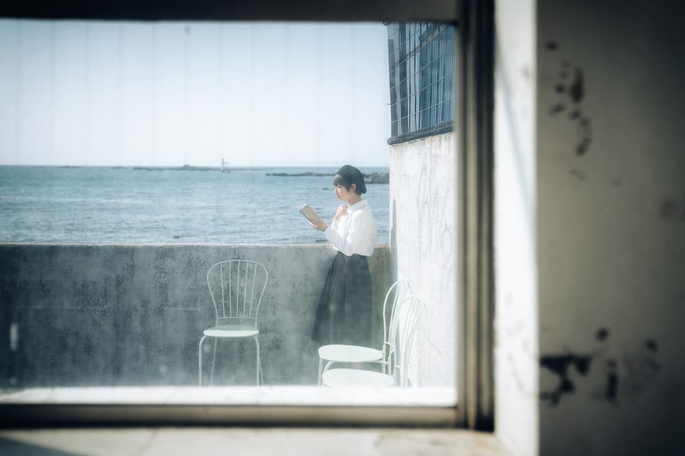 Serene Seaside Reading by Nobu Ishijima — canvas wall art