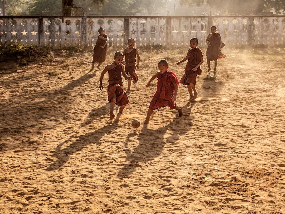 Young Monks Play Soccer by Joe B N Leung — canvas wall art