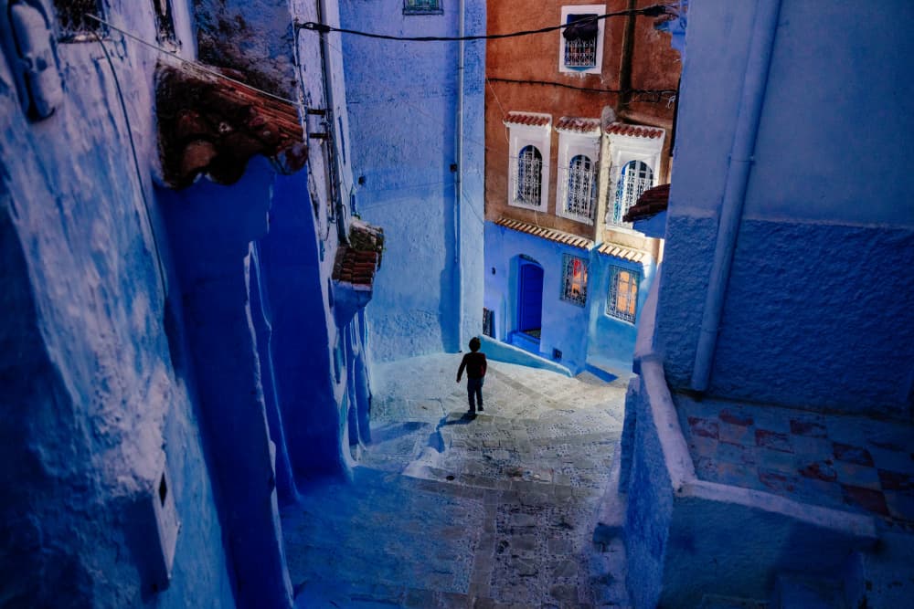 Child In Blue Alley by Francesco Riccardo Iacomino — canvas wall art