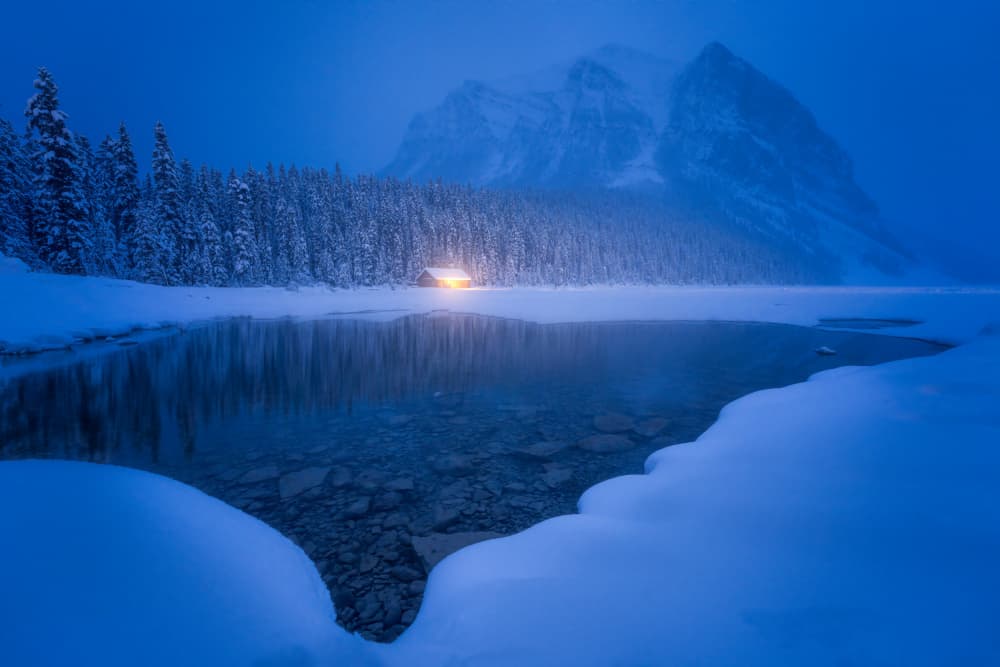 Winter Cabin Glow by Yongnan Li (李永男) — canvas wall art
